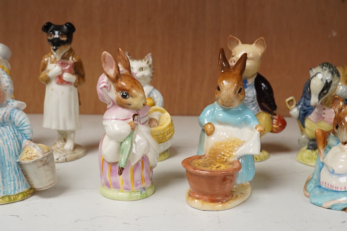 A collection of thirteen Beatrix Potter character figures, stamped with a gold stamp F Warn and Co Ltd, Beswick England, largest 12cm high